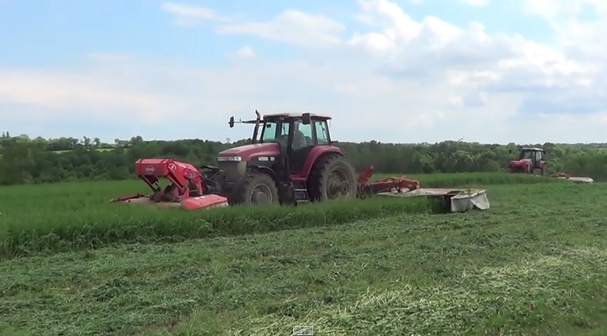 Mowing hay in Wisconsin with two Versatile 2210 tractors and Kuhn ...