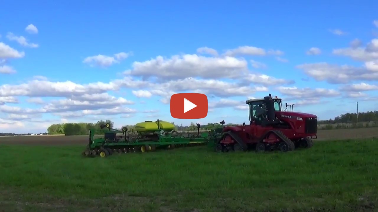 Planting Soybeans in Ohio. Versatile 550 Delta Track tractor pulling a