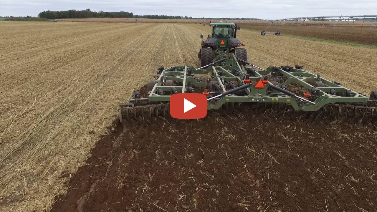 John Deere 9560 RT with a Wishek disk on a Millet field that was just