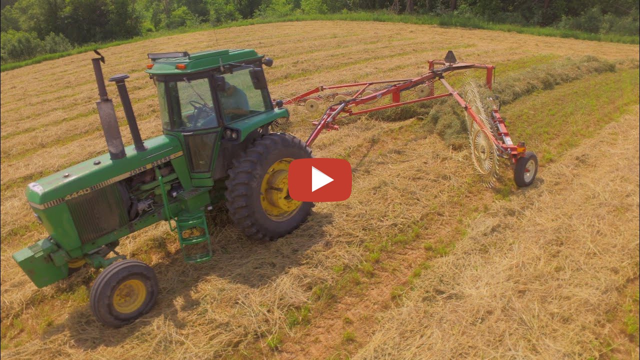 iowadairyboys I rake 1st crop hay (JD 4440 & H&S Wheel Rake) so the