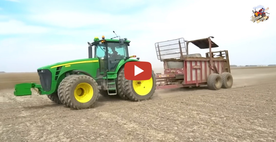 Mike Less Farmhand Mike Two John Deere tractors pulling Hagedorn manure spreaders hauling