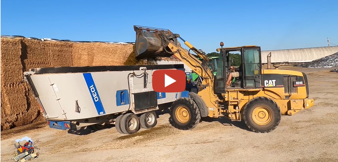 Mike Less Farmhand Mike Mixing Feed for Cows Dairy Farm in