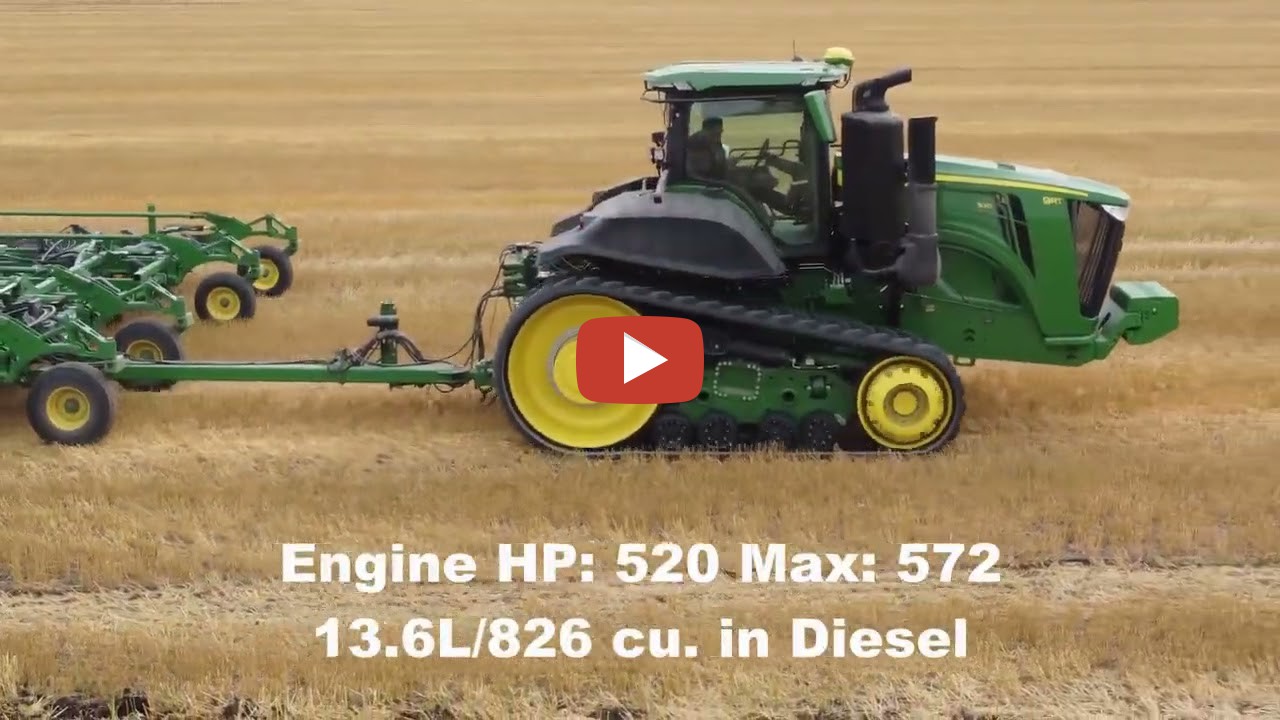 Manitoba A John Deere 9RT 520 HP track tractor pulling a John Deere