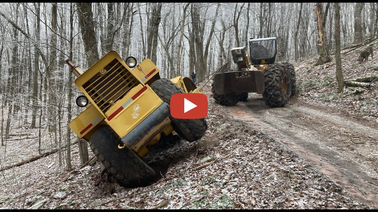 Recovering a stuck roller Using a log skidder to pull a stuck roller